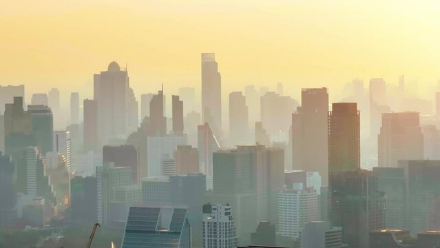 Cityscape in smog. Silhouettes of buildings in the haze. A city with dirty air due to fires. Air pollution. Problem of pollution of the environment. 