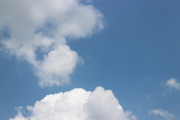 blue sky and white clouds. Freshness of the new day. Bright blue background. Relaxing feeling like being in the sky.