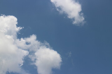 blue sky and white clouds. Freshness of the new day. Bright blue background. Relaxing feeling like being in the sky.