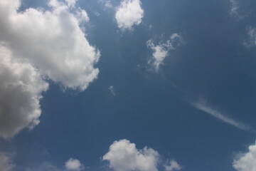 blue sky and white clouds. Freshness of the new day. Bright blue background.