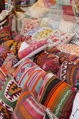 Colourful cushions on display for sale in a traditional Turkish Bazaar.