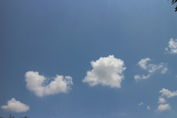 blue sky and white clouds. Freshness of the new day. Bright blue background.