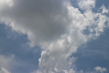 blue sky background with tiny clouds.