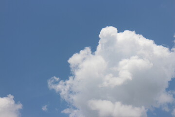 Naklejka na ściany i meble Summer blue sky background with white clouds.