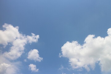 Summer blue sky background with white clouds.