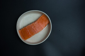 Portioned raw salmon fillets. Top view with copy space.