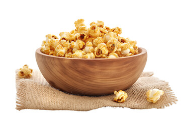 Caramel popcorn in a wooden bowl isolated on a transparent background