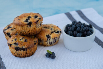 Homemade baked blueberry muffins with fresh blackberries. Tasty pastry sweet cupcake dessert. Berry pie Healthy vegan cupcakes with organic berries. Gluten free healthcare recipe from alternative