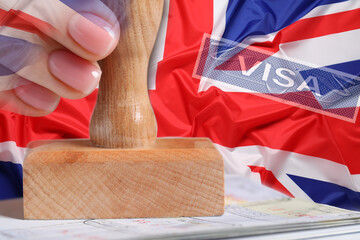 Multiple exposure of woman stamping visa page in passport and flag of Great Britain, closeup