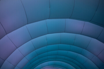 Inflatable structure in detail. Texture of arc lines. Purple glow on the structure.