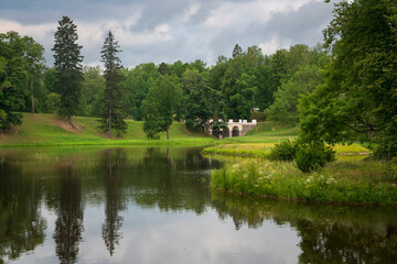 Fototapeta premium View of the Lower Pond in the Oranienbaum Palace and Park Ensemble on a sunny summer day, Lomonosov, St. Petersburg, Russia