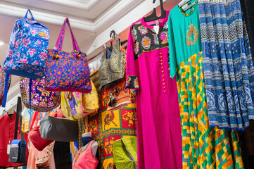 Jodhpur, Rajasthan, India- 15.10.2019 : Rajasthani womens clothes and colorful ladies bags are displayed for sale at famous Sardar Market and Ghanta ghar Clock tower market. Famous place for tourists.