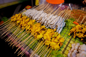 Grilled squid on skewers for sale at the market