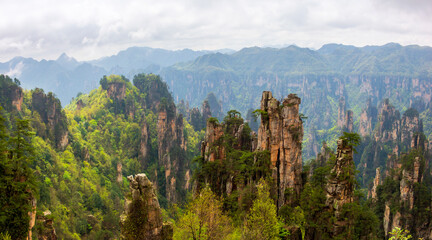 panoranic view of zhangjiajie national forest park Hunan, China.. a view from the top of the mountain. a view of the mountain covered with mist after the rain.	