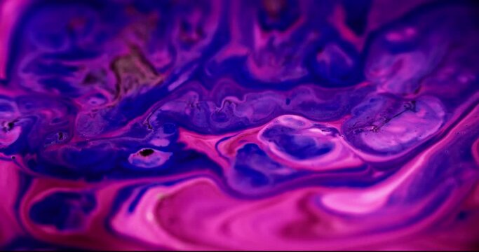 Sparkling ink flow. Acrylic mix. Blur neon pink purple color layers shimmering dust glitter particles texture paint fluid wave motion abstract art background.