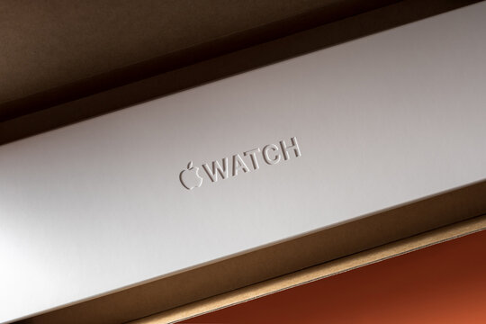 Apple Watch Series 8 package, white cardboard box with embossed logo in shipping carton box with cushion components.