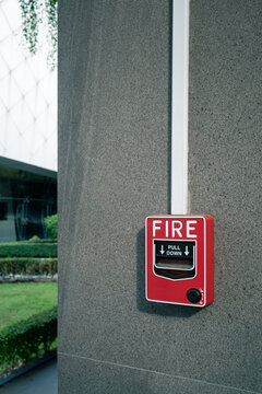 fire alarm system on wall at open air shopping plaza, shallow depth of field