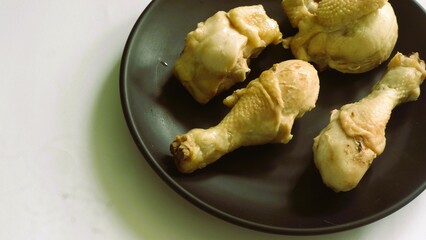 Raw chicken meat fillet, thigh, wings and legs on a white background. Top view with copy space.