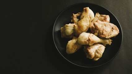 Raw chicken meat fillet, thigh, wings and legs on a white background. Top view with copy space.