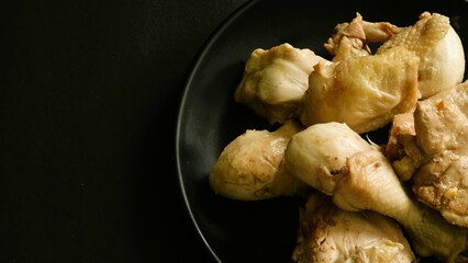 Raw chicken meat fillet, thigh, wings and legs on a white background. Top view with copy space.