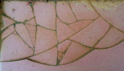 Obraz premium Cracks On The Surface Of A Worn Ceramic Floor