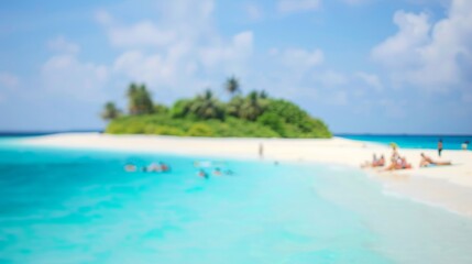 Out-of-focus image capturing a dreamy tropical beach atmosphere with tourists enjoying the sands.