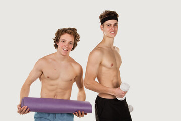 Fototapeta na wymiar Gay couple. Two young attractive guys are playing sports.