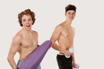 Fototapeta na wymiar Gay couple. Two young attractive guys are playing sports.
