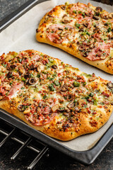 Tasty italian square pizza on kitchen table. - 794763855
