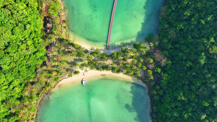 Drone's eye view, Pristine sandy beach, azure waters, and lush coconut trees. Nature's masterpiece in the heart of the tropics. Travel and adventure concept. Ko Ngam, Thailand.  
