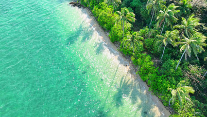 A breathtaking tropical island seen from above. Pristine waters, golden sands, and coconut trees dancing in the breeze. Picture-perfect paradise. Natural wonders concept. Ko Chang island, Thailand.
