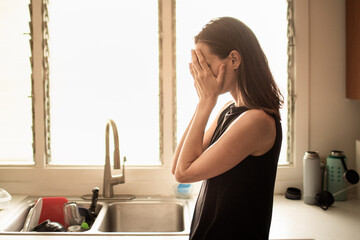 Woman in the kitchen feeling sad tired stressed overworked worried suffering depression mental health family problems - obrazy, fototapety, plakaty