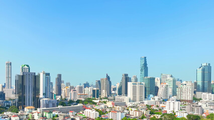 Fototapeta na wymiar Drone Aerial view, Observing urban landscape, drone navigates through high-rise clusters and towering skyscrapers. Metropolitan concept. Bangkok, Thailand. 
