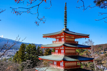 The iconic view of Mount Fuji with the red Chureito pagoda and Fujiyoshida city from Arakurayama...