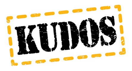 KUDOS text written on yellow-black stamp sign.