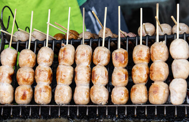 round fried sausages as a background.