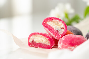 Multi-colored Japanese cakes Mochi in a white plate