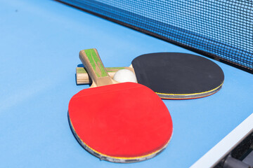 table tennis ball and paddle