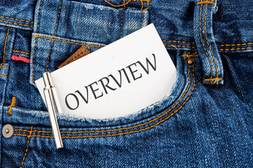 OVERVIEW written on a business card peeking out of a jeans pocket