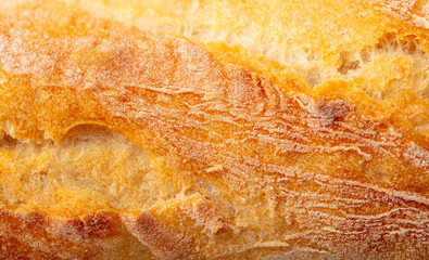 Ruddy crust of bread as an abstract background. Texture