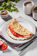 oatmeal pancake with cream cheese and strawberries