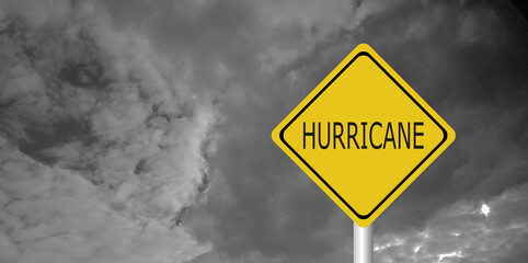 Hurricane Idalia warning sign against a powerful stormy background with copy space. Dirty and...