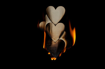 Valentine homemade wooden love hearts burning an burned smoking with unique patterns and textures