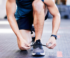 Fitness, man and hands tie shoes in gym for running challenge, cardio workout or endurance...