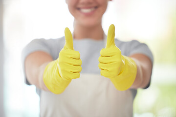 Happy cleaner, hands and thumbs up with gloves for housekeeping, thank you or cleaning service at home. Closeup of person or maid with like emoji, yes sign or ok for review, vote or rating in hygiene