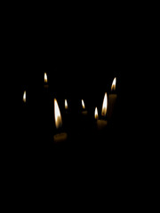 candles in the night or isolated on black background