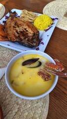 Seafood lunch: seafood soup and grilled baked fish, top view