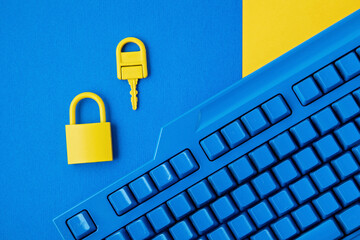 Cyber data and information security idea. Yellow padlock and key and blue keyboard. Computer,...