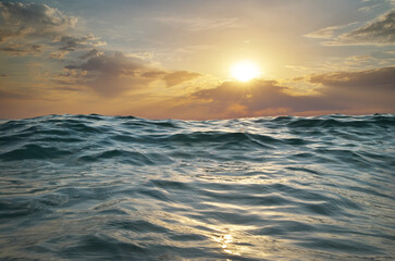 Sea waves on sunset