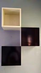 Three box shelves on the wall